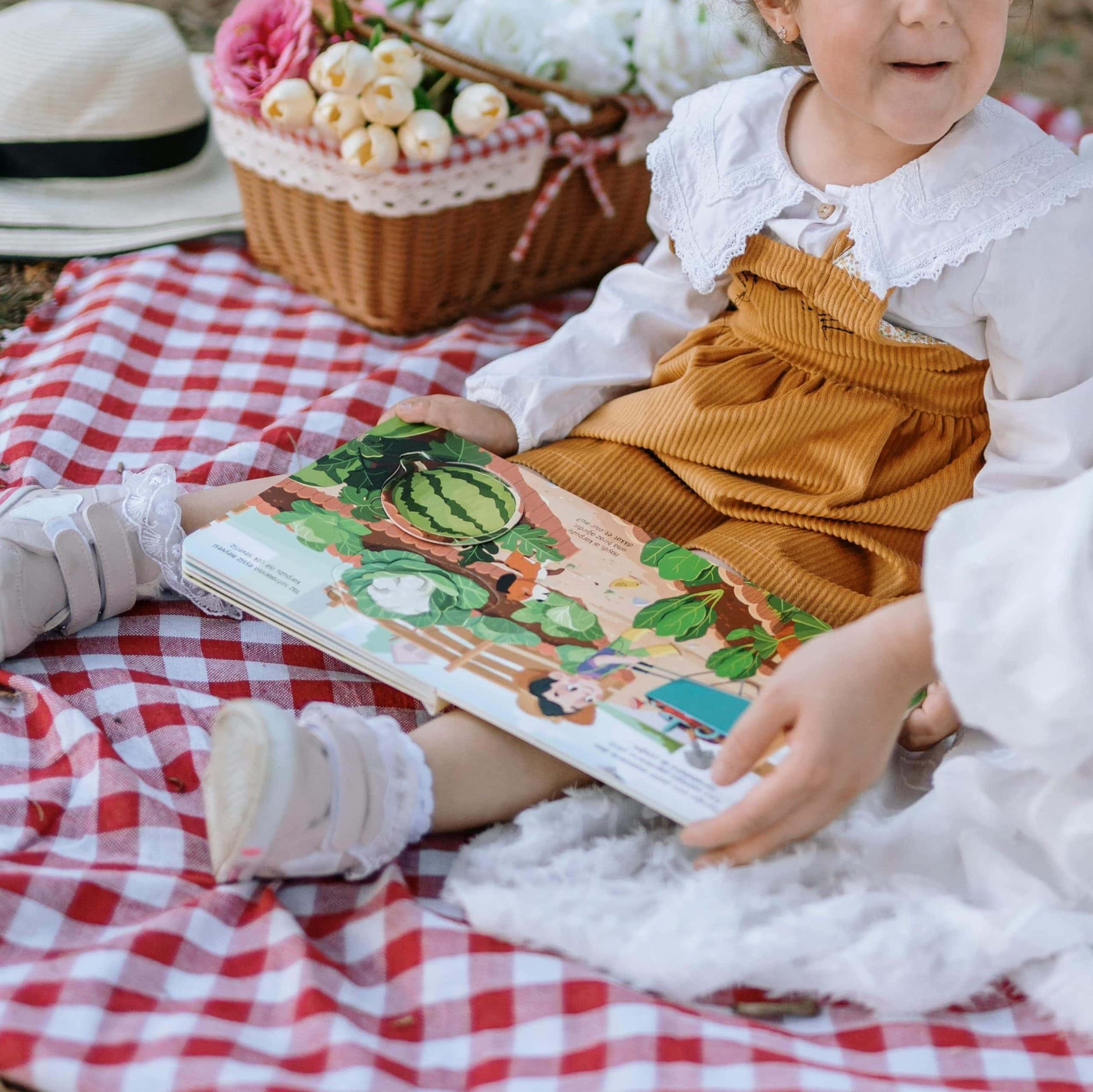 Child holding a board book