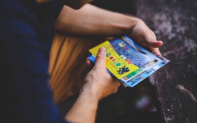 Man holding postcards