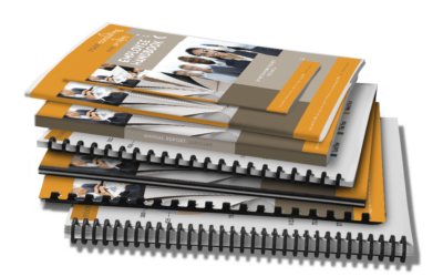 Stack of booklets with different binding types. Spiral bound, comb bound, perfect bound, and saddle stitched booklets.