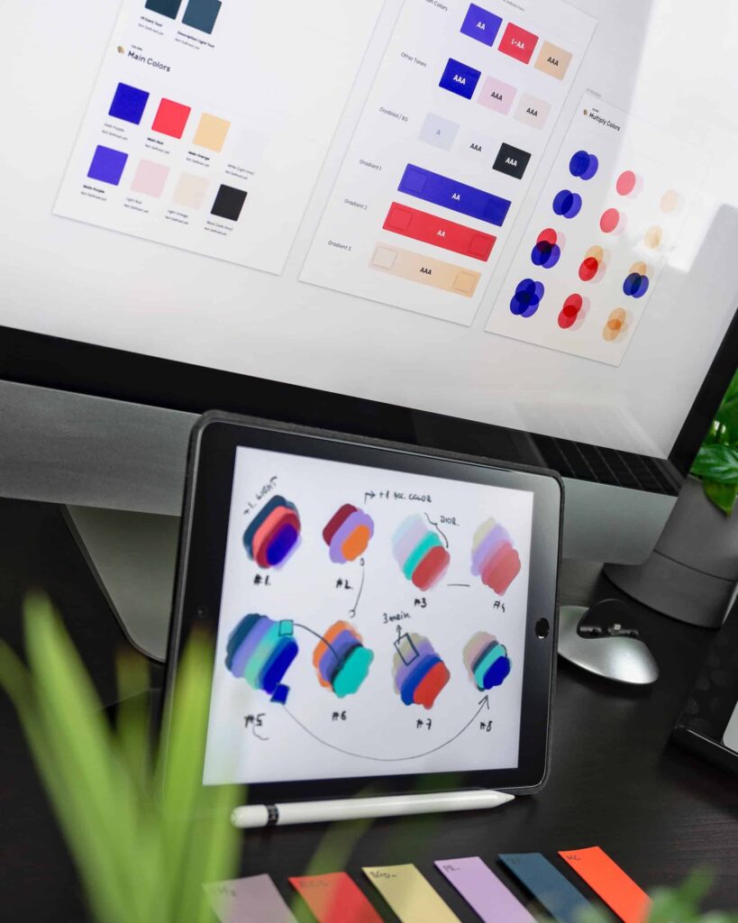 Choosing brand colors on a iPad and desktop computer.