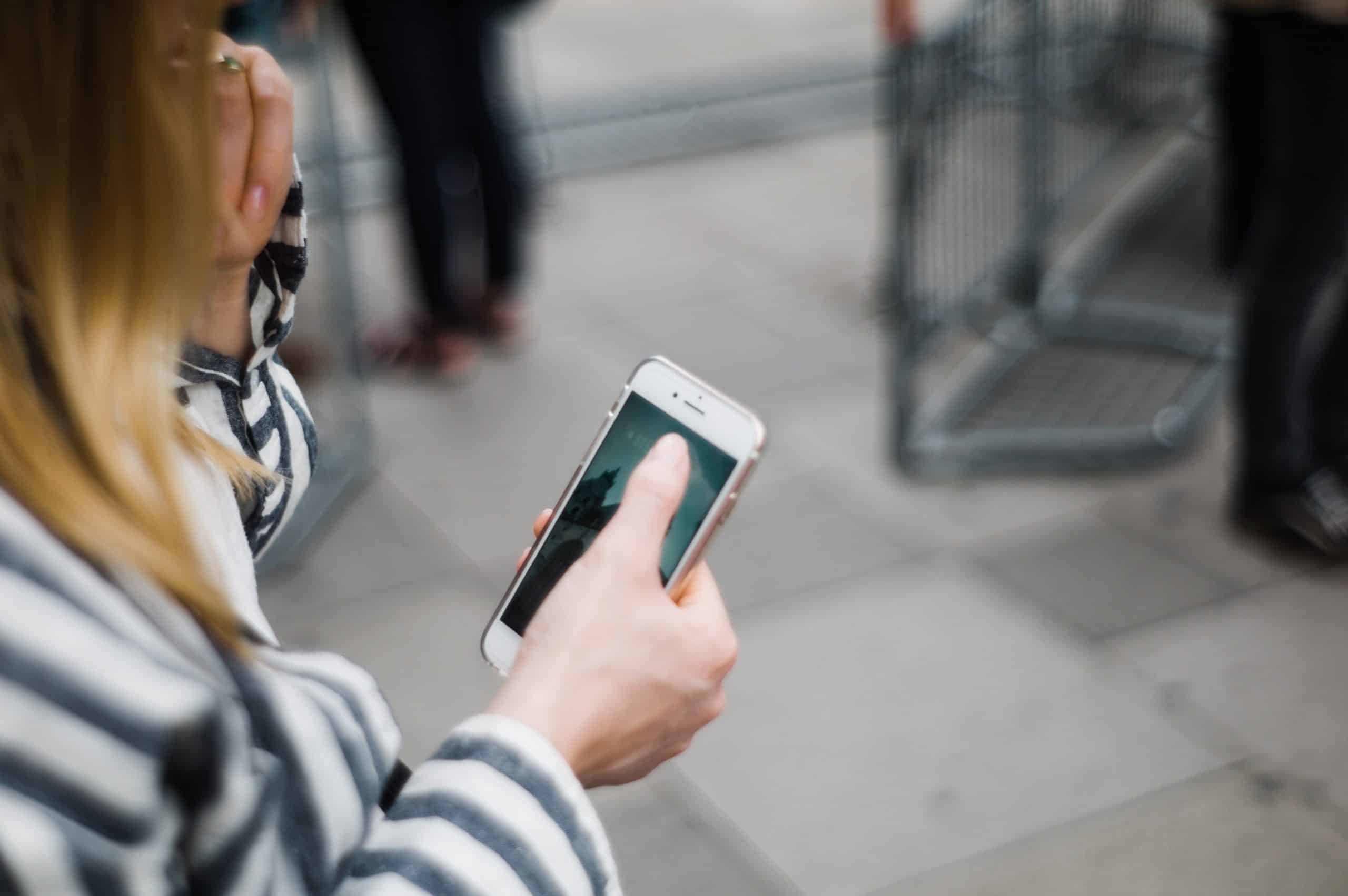 Woman scrolling through her phone