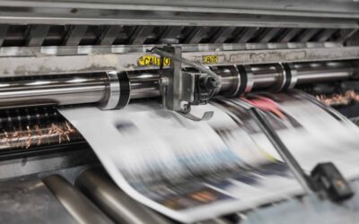 paper coming out of a printing press