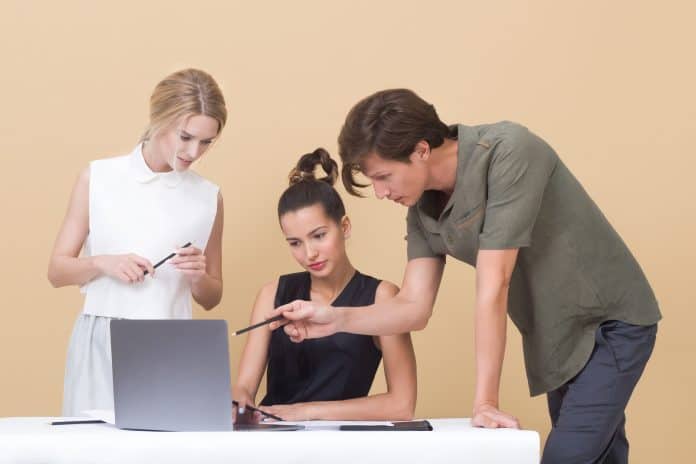 People collaborating over a laptop