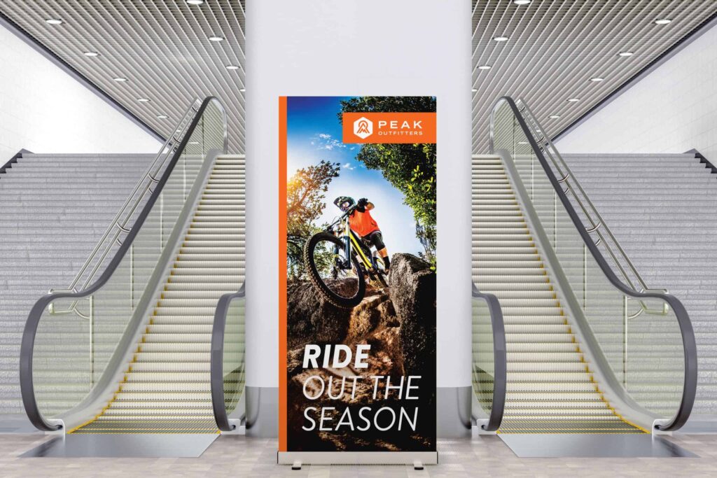 Blank retractable banner stand in public space. Include clipping path around ad banner. 3d illustration