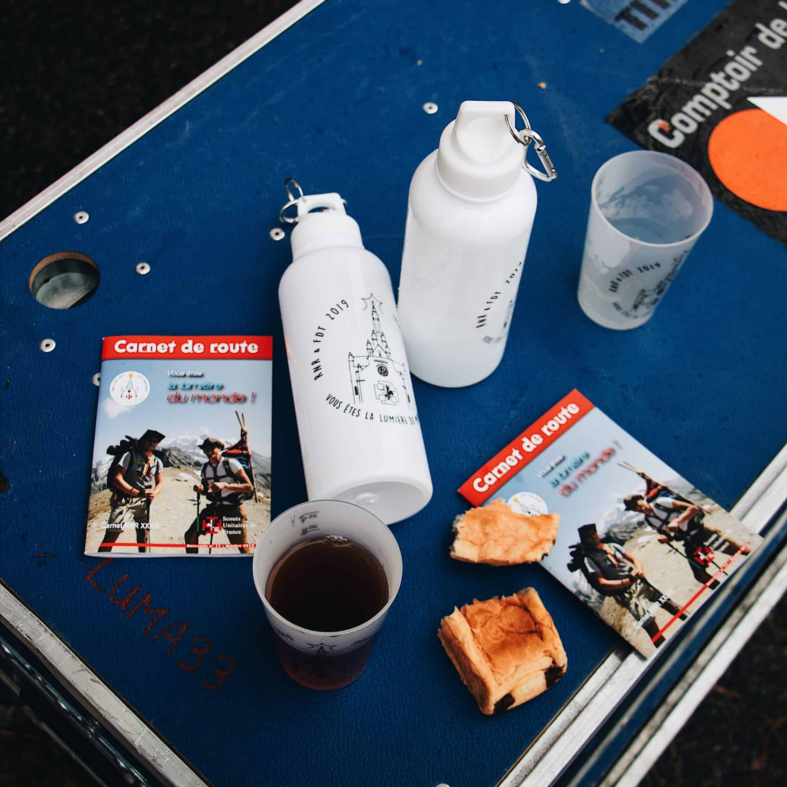 Travel brochure books on a camping table