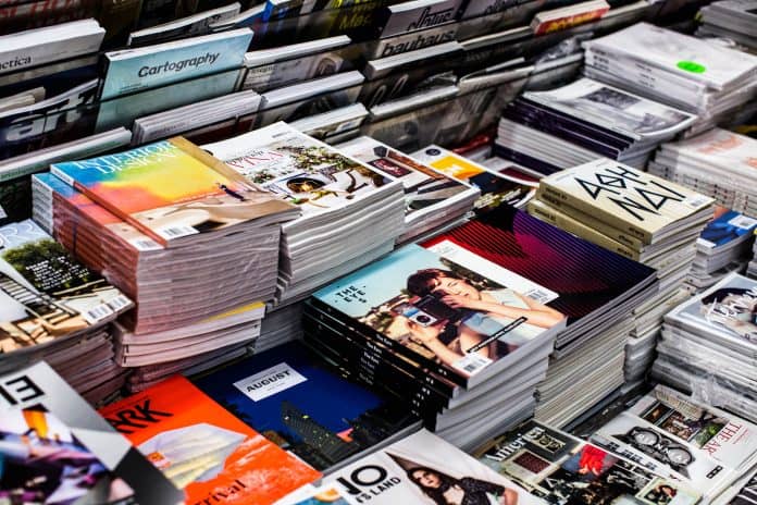 stacks of softcover vs paperback books