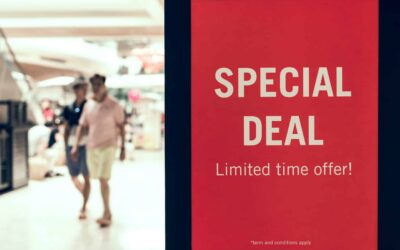 man walking inside mall and sign for scarcity marketing