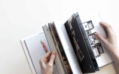 Flipping through the pages of an opened lookbook or catalog