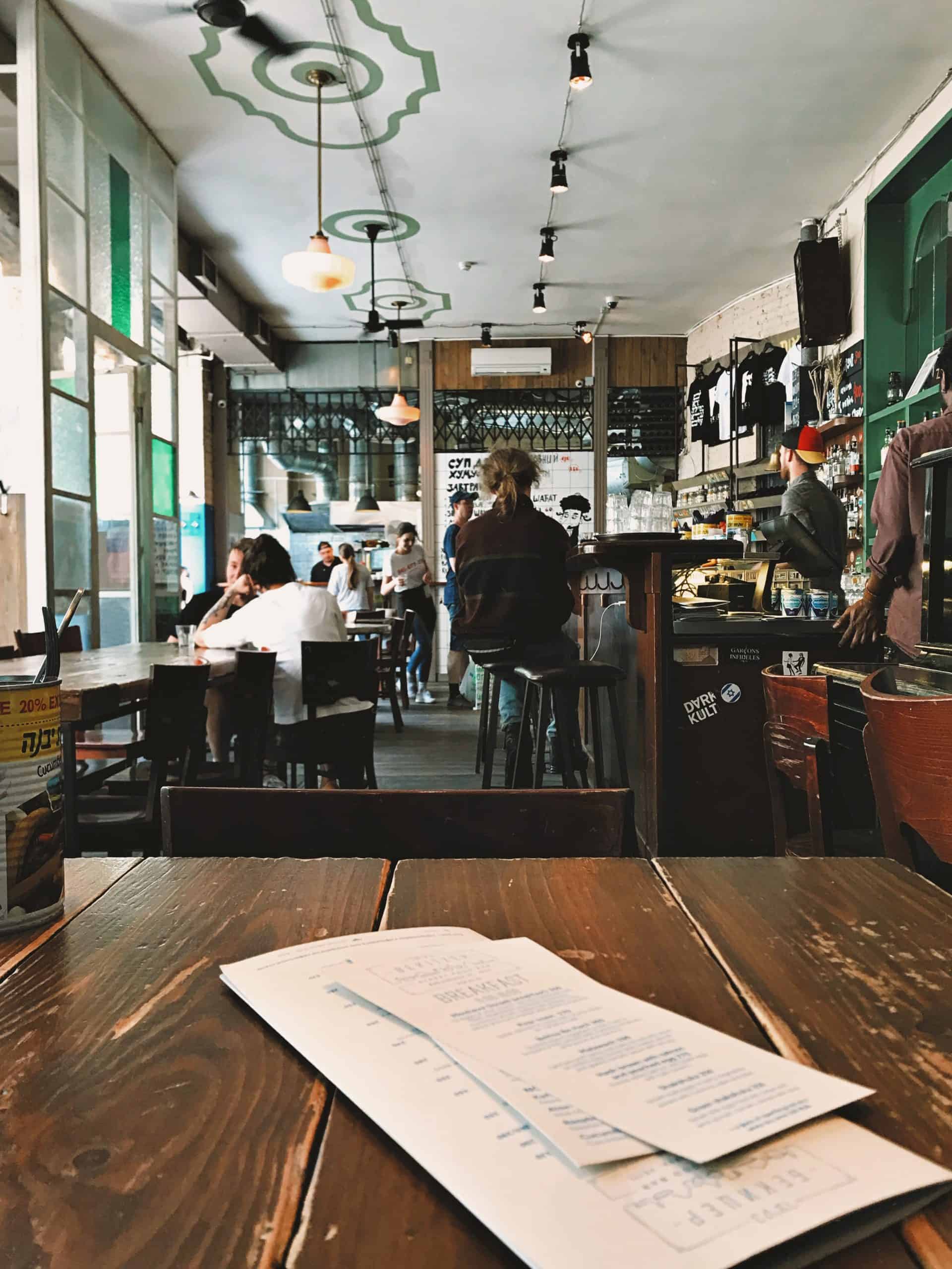 menus laying on a table in a restaurant