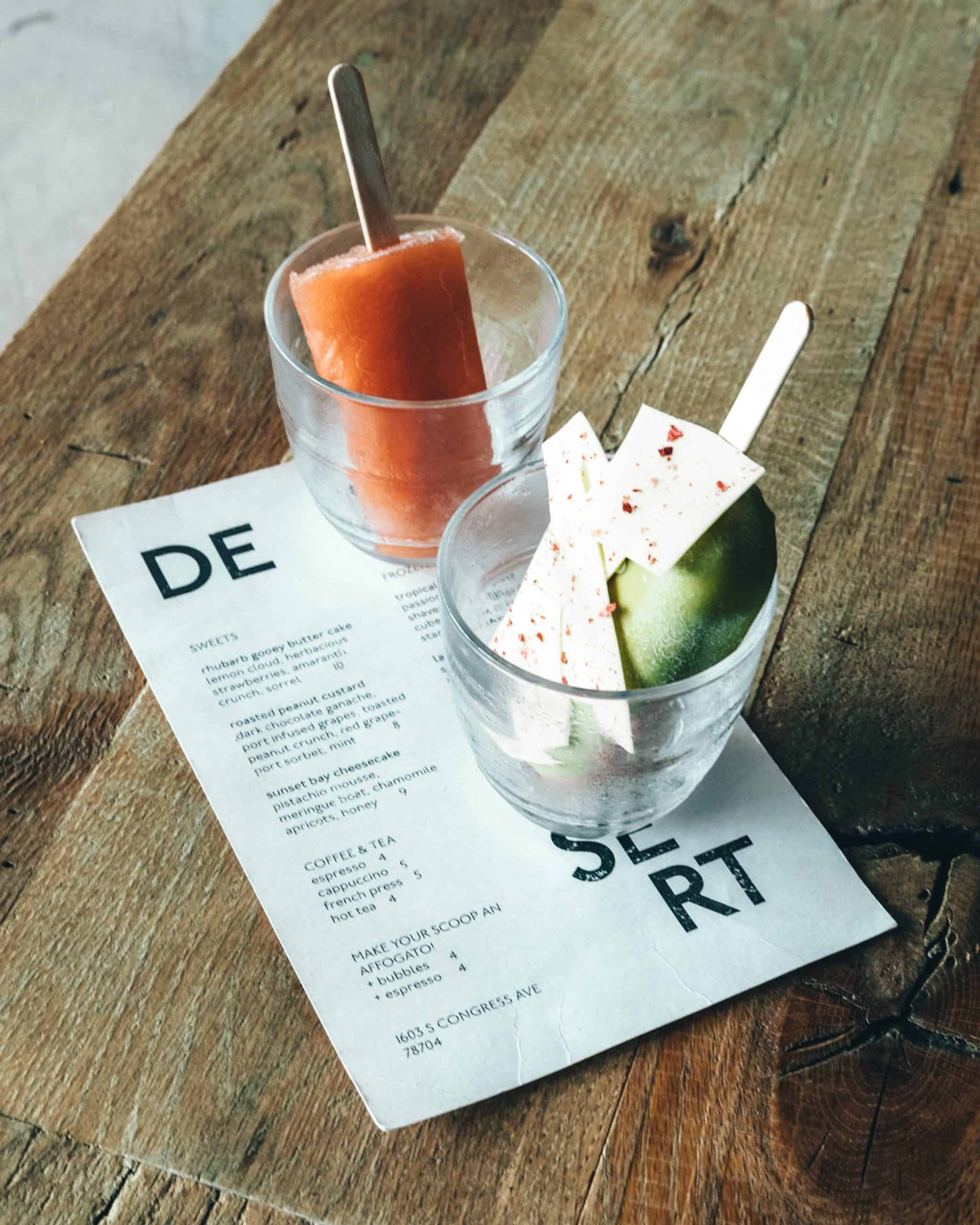 popsicles in a cup on a printed menu