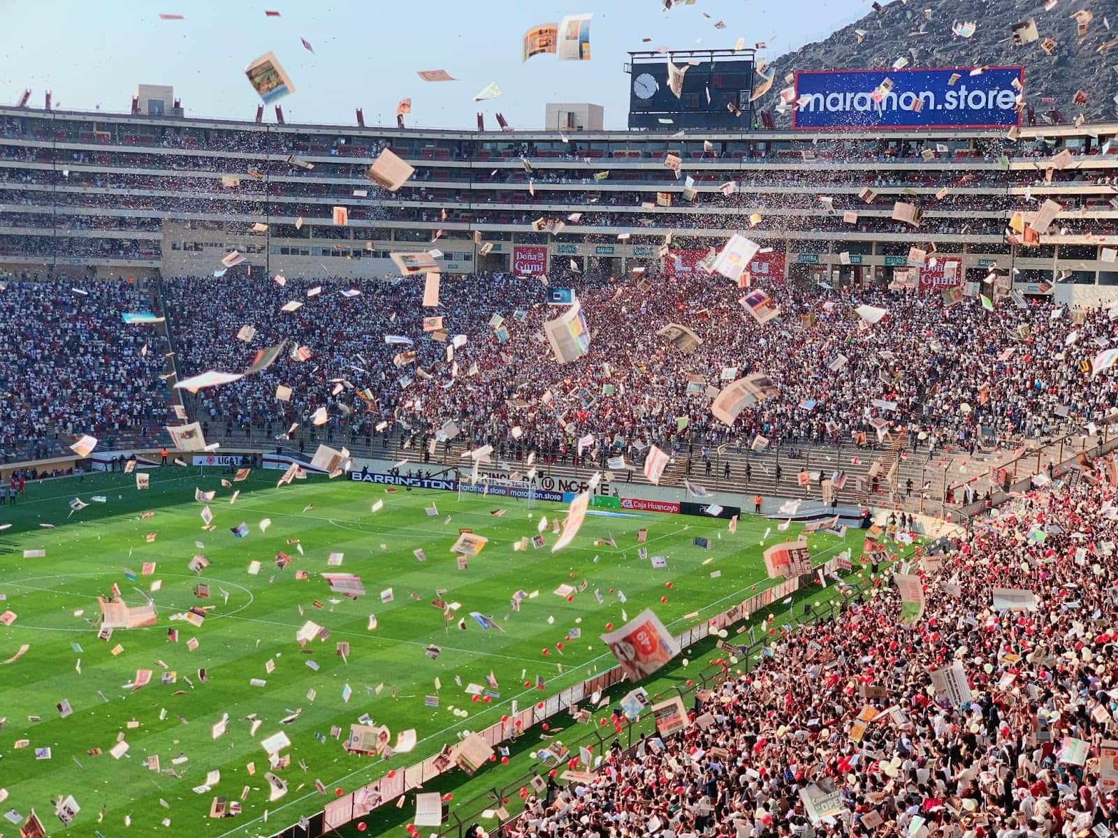 Sports stadium with sports programs flying in the air