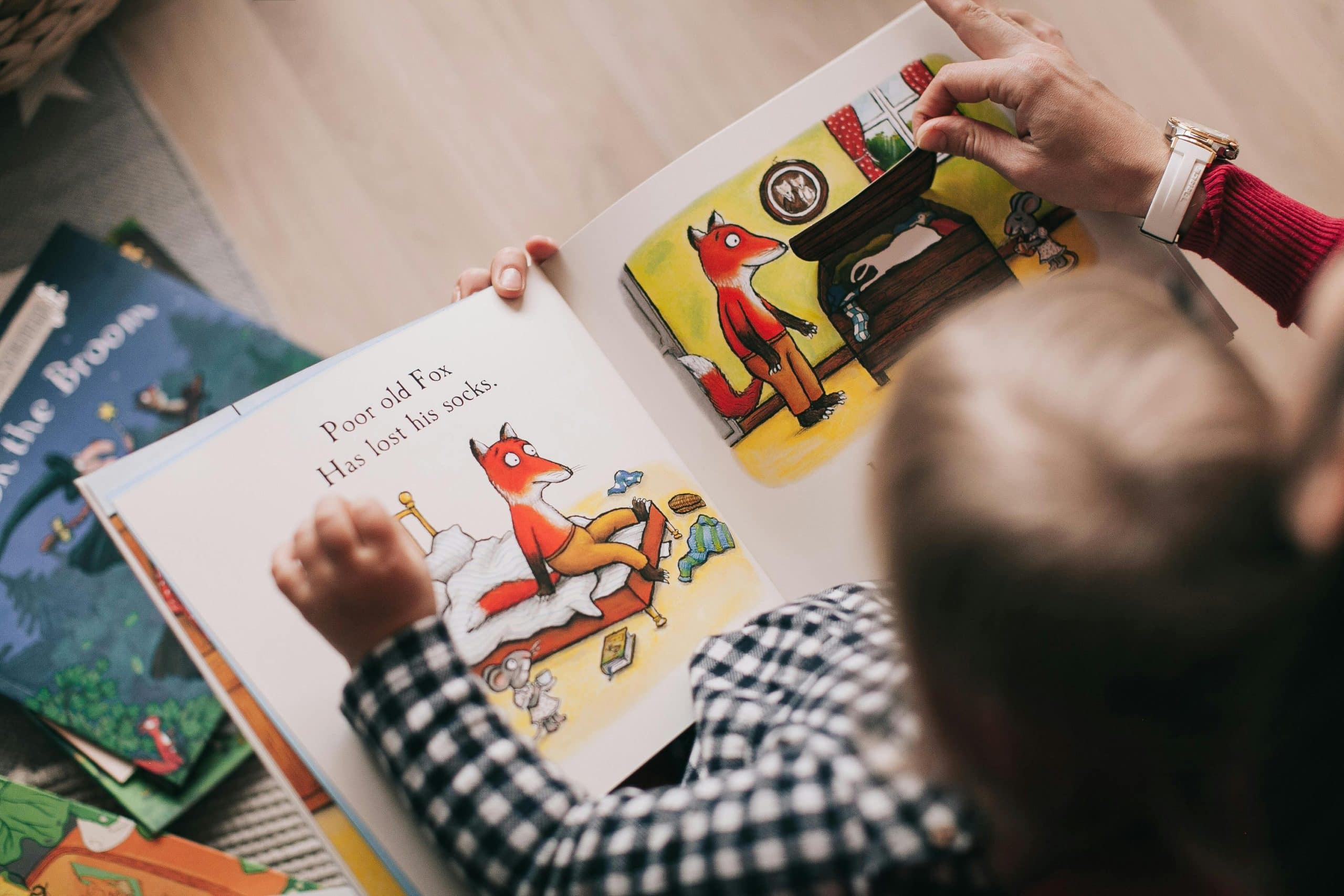 Childrens book being held