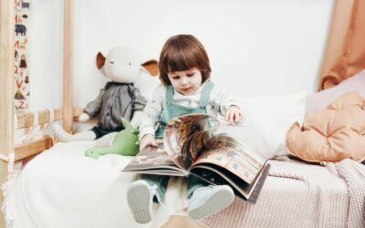 A child opening a hard cover book